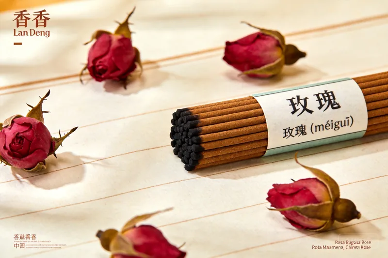 Small dried rose buds in a ceramic dish.